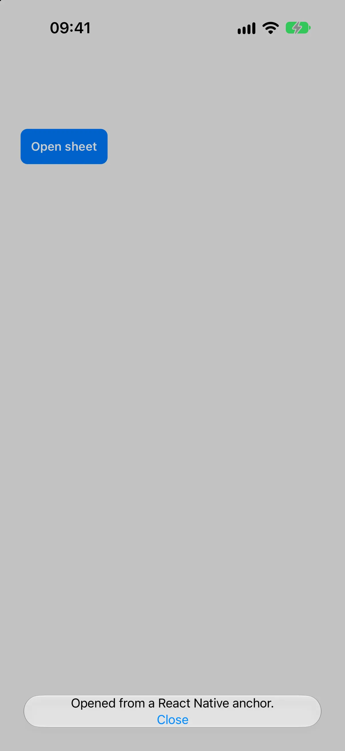 A blue React Native button above a bottom sheet sized to its content